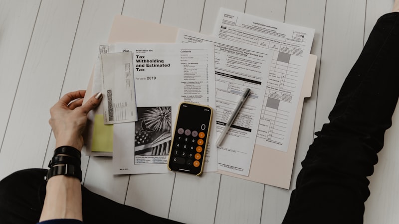 Financial documents and calculator — mortgage stress test